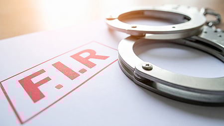 பண மோசடி: இருவா் மீது வழக்கு